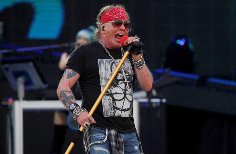 Axl Rose on stage with mic
