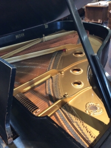 inside of black grand piano