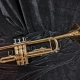 used trumpet on black background