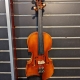3/4 violin hanging on a slatted wall