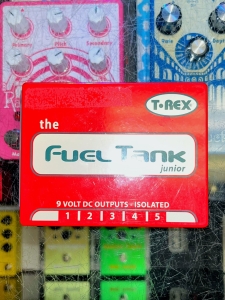 Used Red T-REX the Fuel Tank Jr Pedal Power Supply on Store Countertop