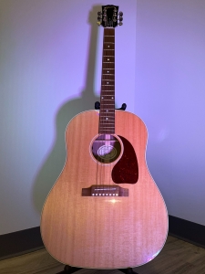 Gibson J-45 Studio Acoustic Guitar in Walnut on a stand