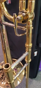 Closeup picture of a trombone slide showing light wear and sratching