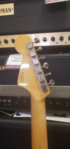 Used Fender Ventera Jazzmaster Ice Blue Metallic closup of back of headstock