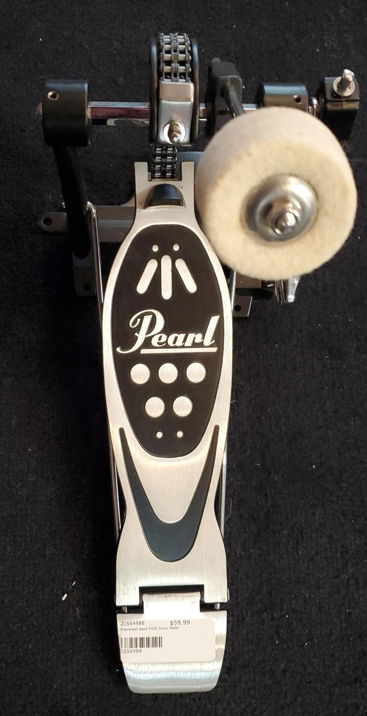 Pearl bass drum pedal sitting on black carpet